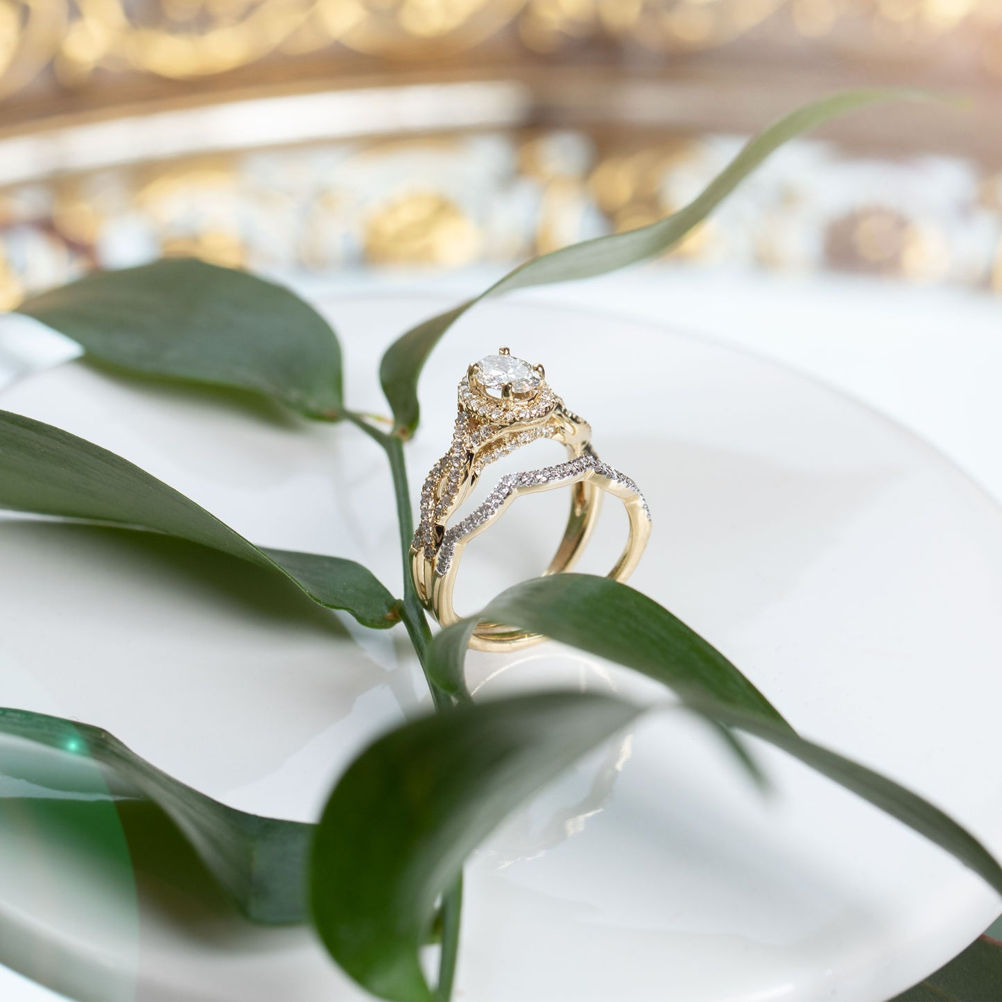 Amaura Collection 1 ct. tw Oval Halo Wedding Set with Side Twist Design in 14K Yellow Gold - 14Y-OV angled view