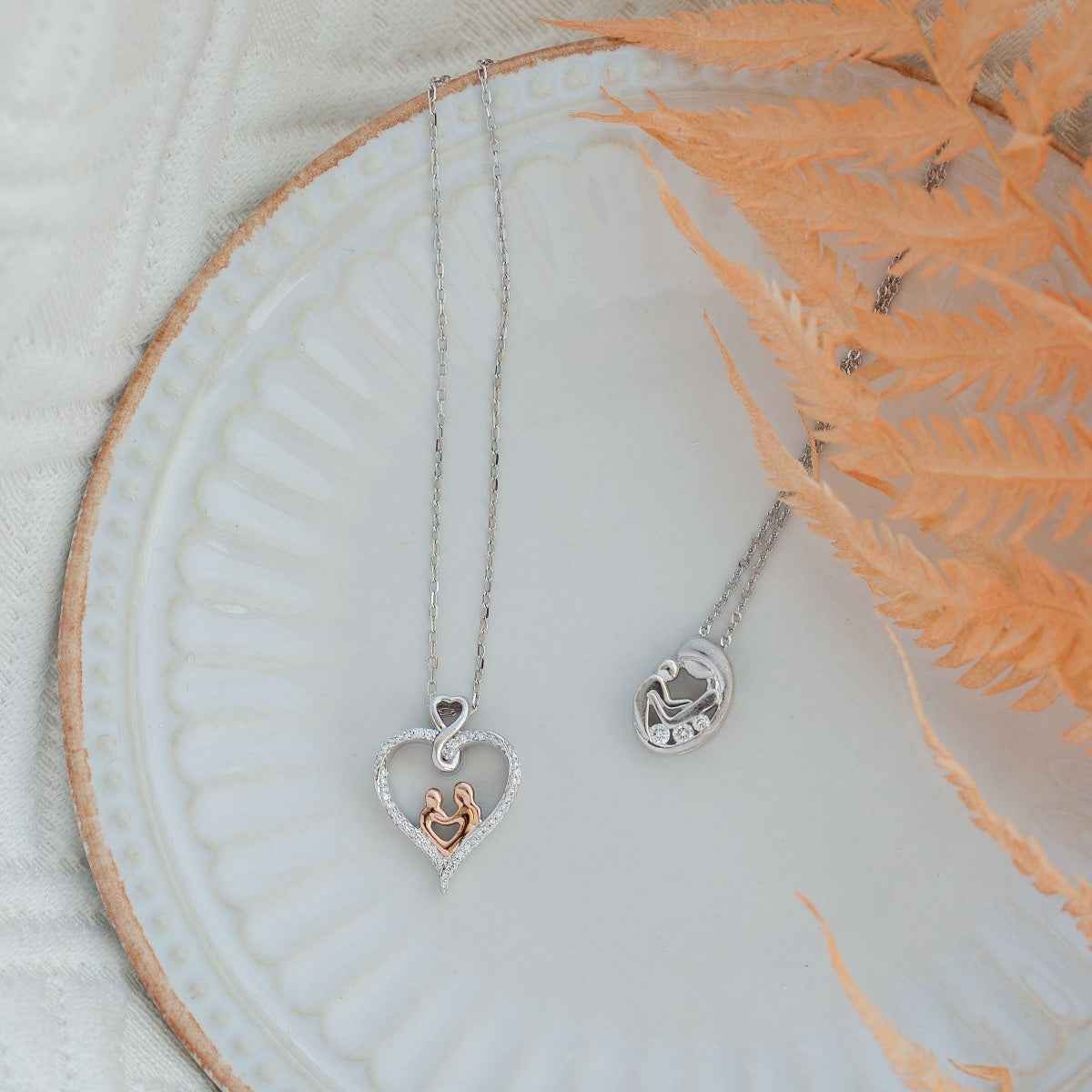 Infinite Love 1/8 ct. tw. Diamond Mom & Child Pendant in Sterling Silver and 10K Pink Gold front view
