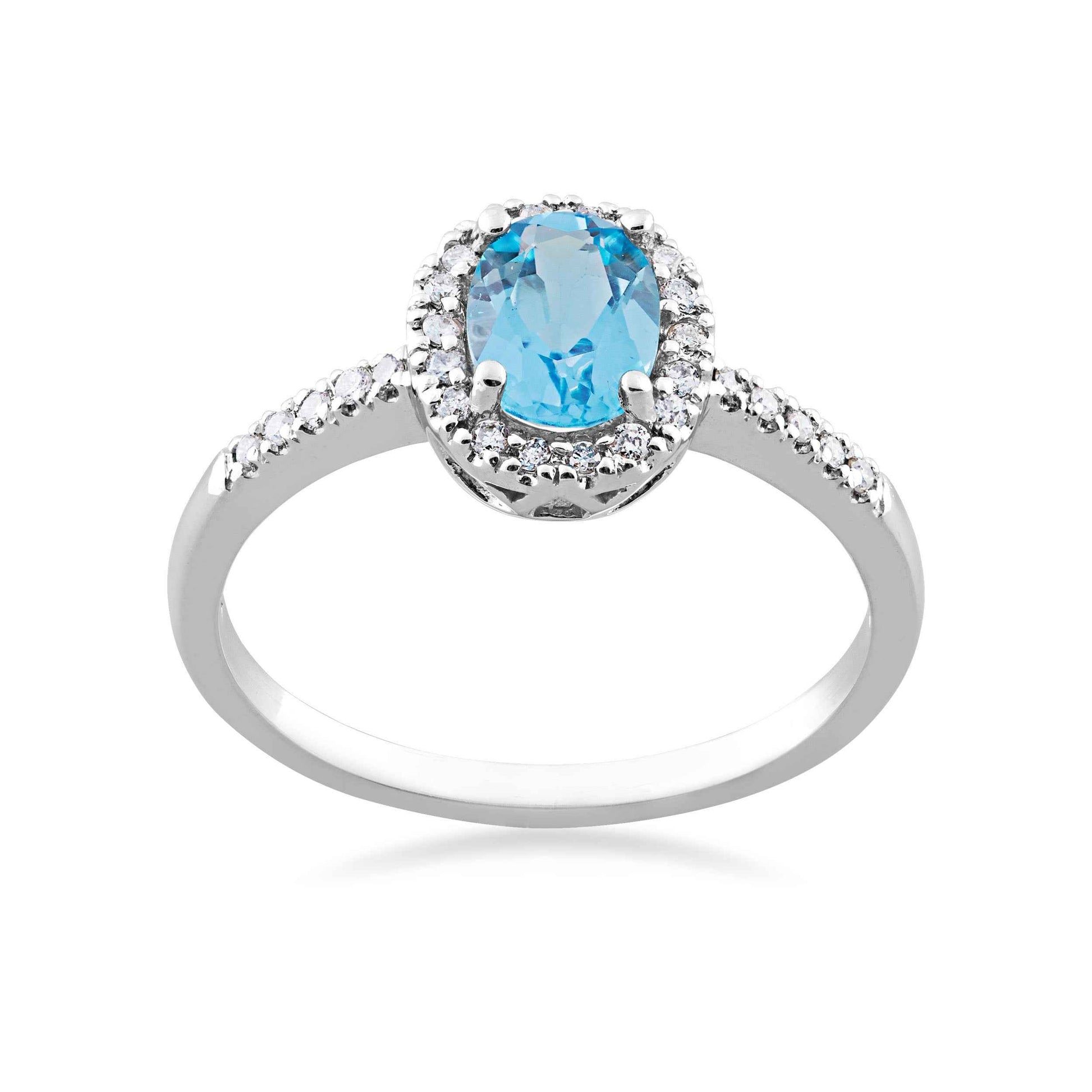 Genuine Oval Blue Topaz & 1/7 ct. tw. Diamond Halo Fashion Ring in 10K White Gold