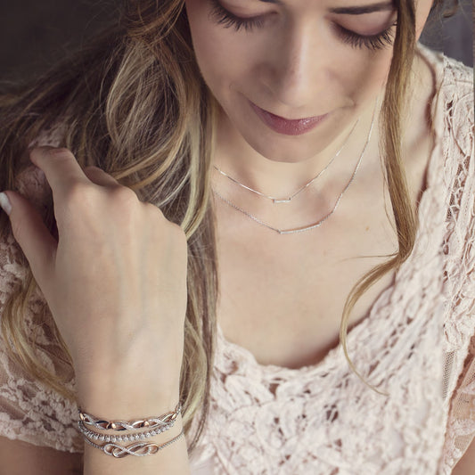 1/7 ct. tw. Diamond Double Infinity Fashion Bolo Bracelet in Two-Tone Sterling Silver front view