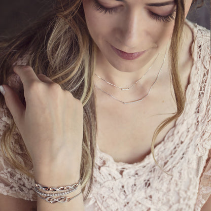 1/7 ct. tw. Diamond Double Infinity Fashion Bolo Bracelet in Two-Tone Sterling Silver front view