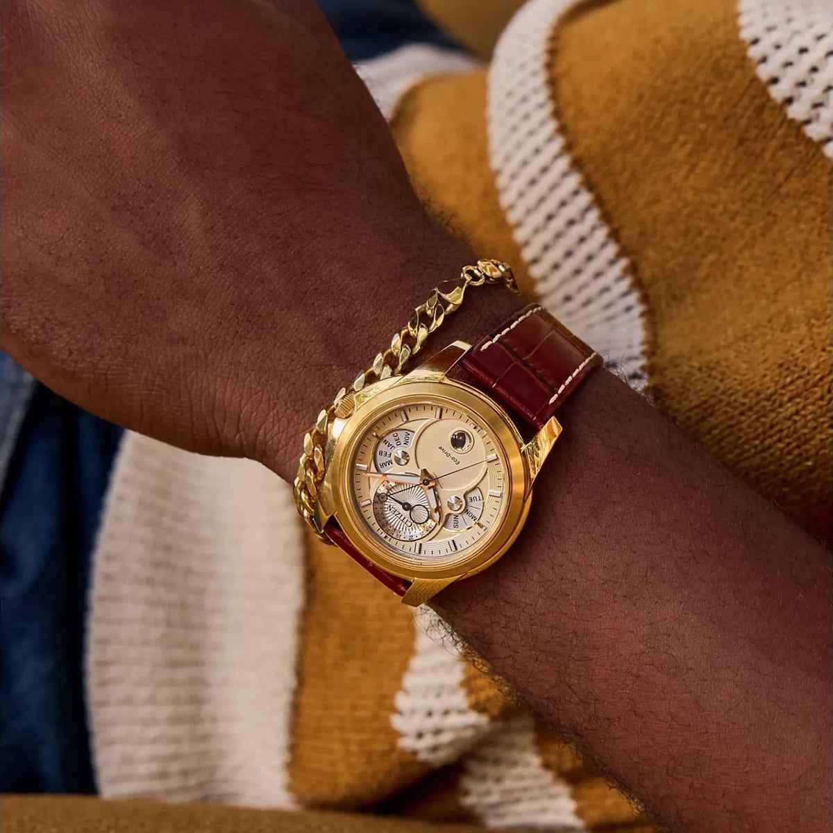 Citizen Men's Calendrier Eco-Drive Gold-Tone Stainless Steel Watch with Champagne Dial & Brown Leather Strap close-up detail