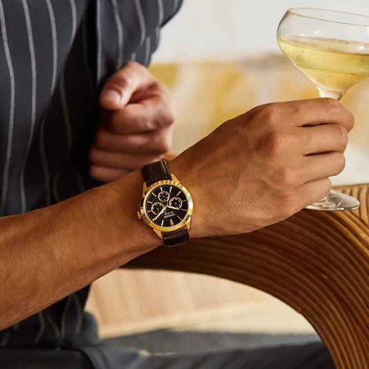 Citizen Men's Rolan Eco-Drive Gold-Tone Stainless Steel Watch with Black Dial & Brown Leather Strap close-up detail
