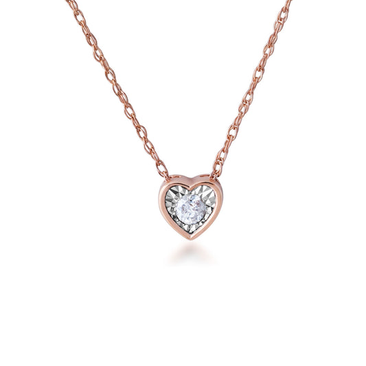 1/10 ct. tw. Diamond Heart Shaped Bezel Pendant in 10K Pink and White Gold
