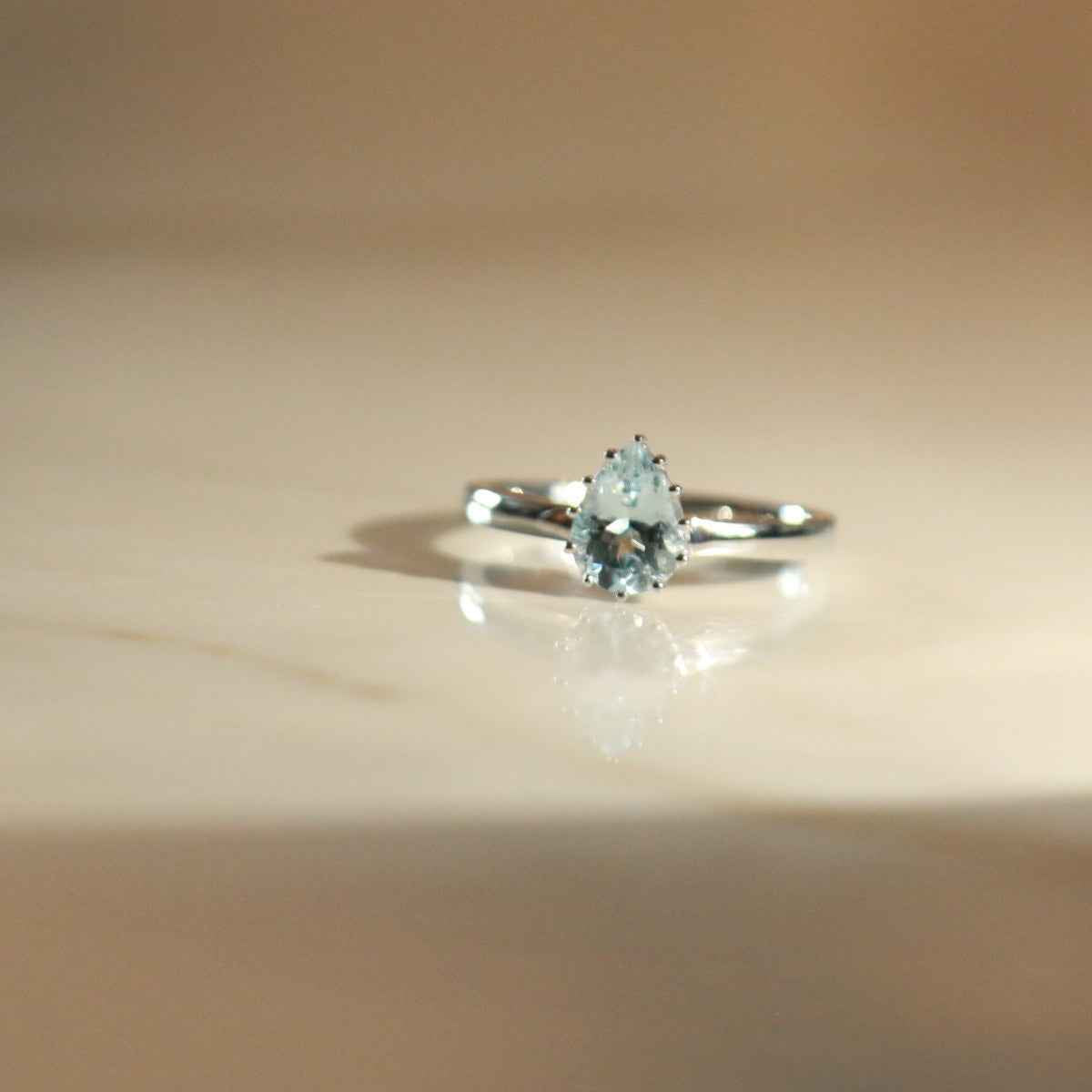 Pear Aquamarine Solitaire Ring in 10K White Gold side profile