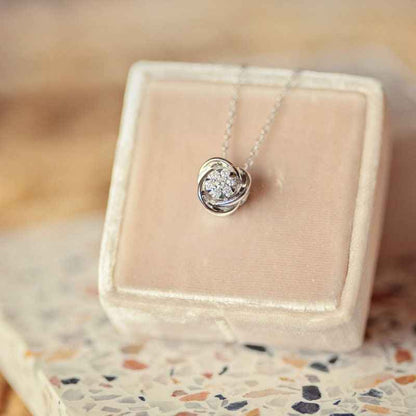 Love Knot 1/10 ct. tw. Diamond Cluster Pendant in 10K White Gold front view
