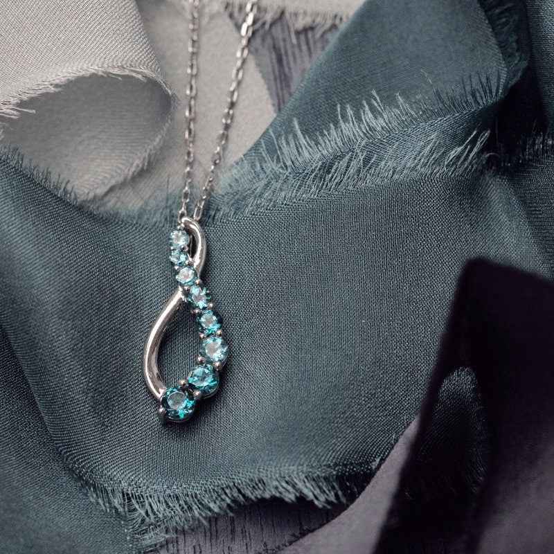 Journey Collection Blue Topaz 8 Stone Fashion Pendant in Sterling Silver front view