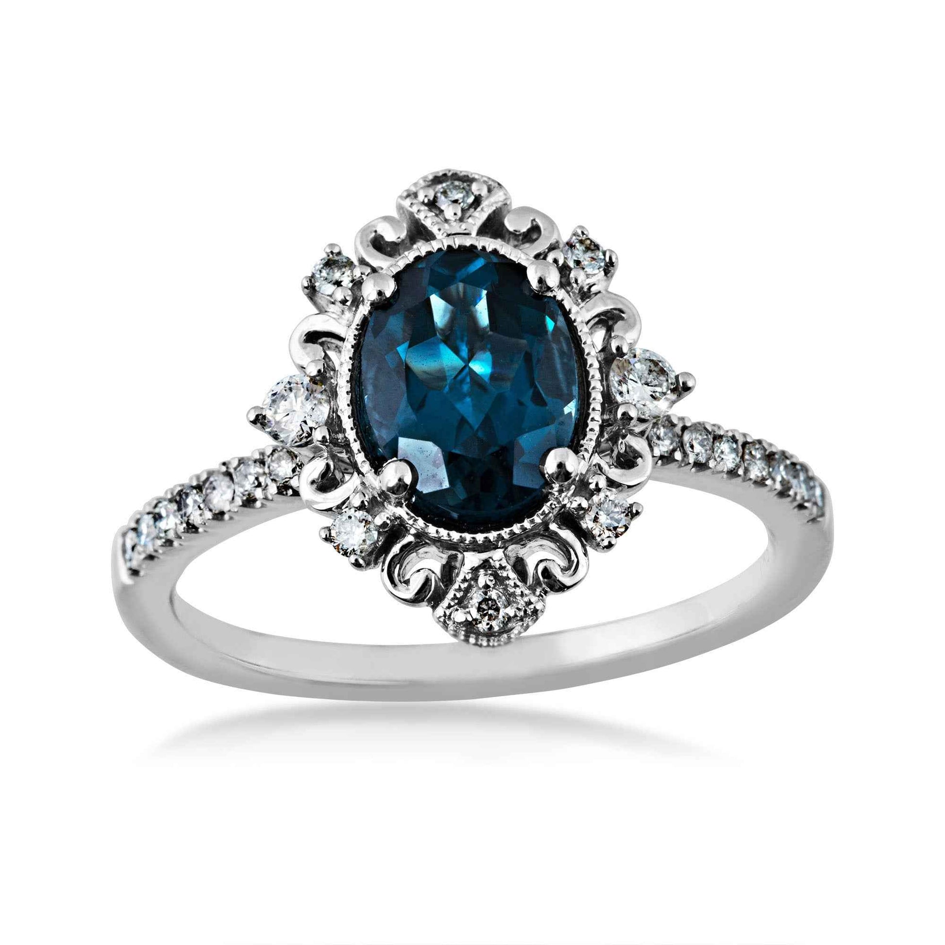 Impulse Collection Genuine Oval London Blue Topaz Engagement Ring with 1/4 ct. tw. Diamond Filigree Inspired Halo & Band in