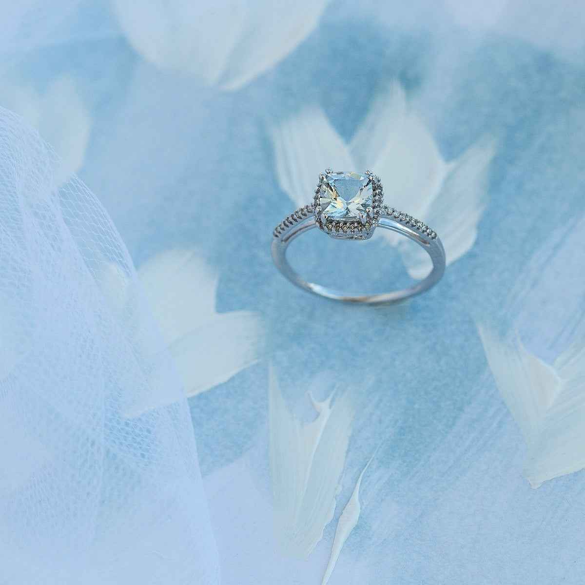 Genuine Cushion Cut Aquamarine & 1/10 ct. tw. Round Diamond Halo Ring in 10K White Gold front view