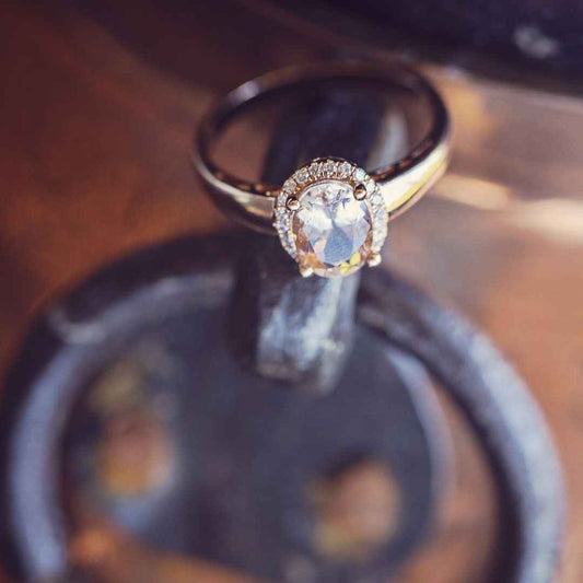 Genuine Oval Morganite Fashion Ring with 1/8 ct. tw. Diamond Halo in 10K Pink Gold close-up detail