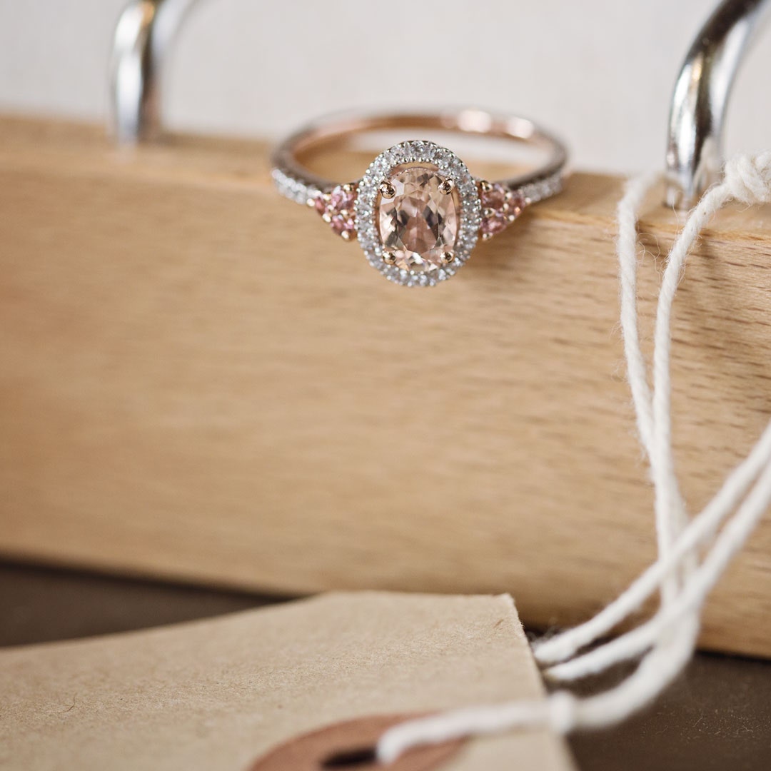 Impulse Collection Genuine Oval Morganite Fashion Ring with 1/10 ct. tw. Diamond Halo & Pink Sapphire Accented angled view