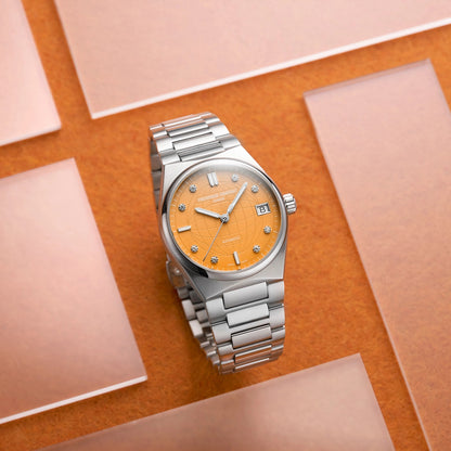 Frederique Constant Ladies' Automatic Stainless Steel Watch with Orange Dial close-up detail