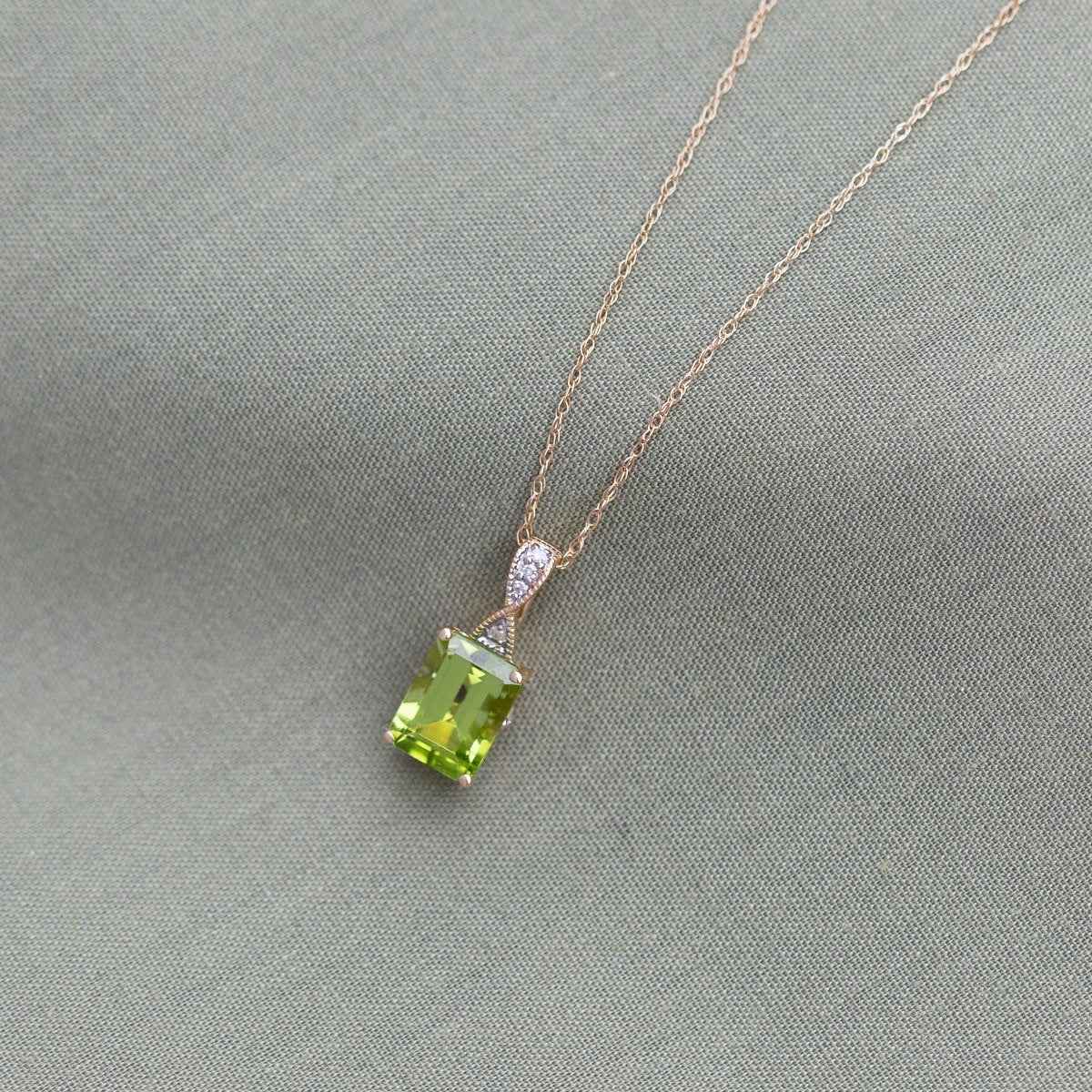 Peridot and .02 ct. tw. Diamond Fashion Pendant with Upper Infinity-Inspired Design in 10K Yellow Gold front view