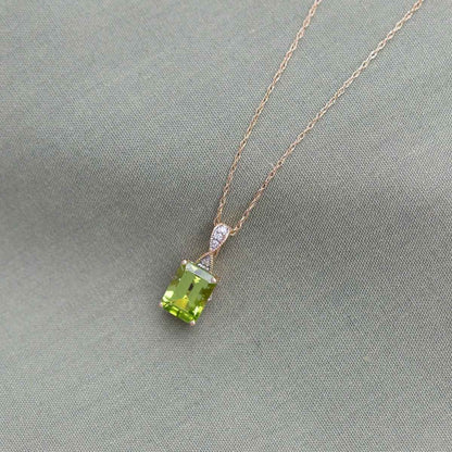 Peridot and .02 ct. tw. Diamond Fashion Pendant with Upper Infinity-Inspired Design in 10K Yellow Gold front view