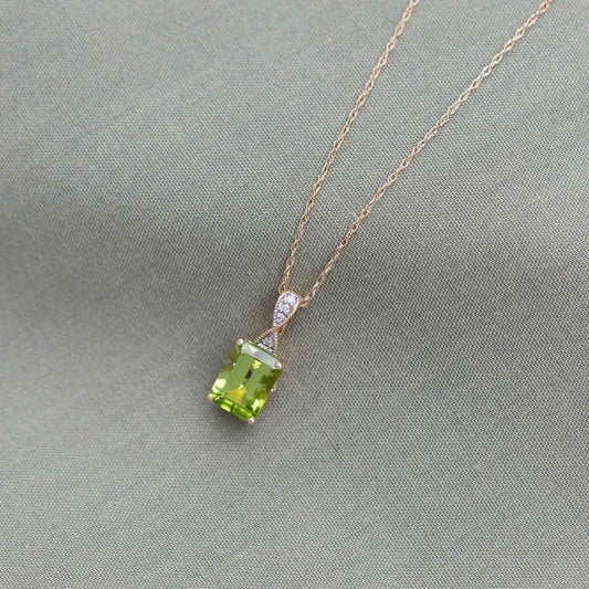 Peridot and .02 ct. tw. Diamond Fashion Pendant with Upper Infinity-Inspired Design in 10K Yellow Gold front view
