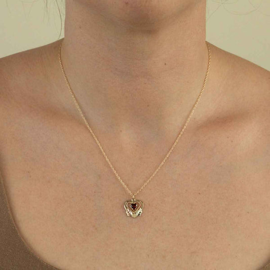 Black Hills Gold Garnet Milgrain Double Heart Pendant in 10K Yellow Gold front view