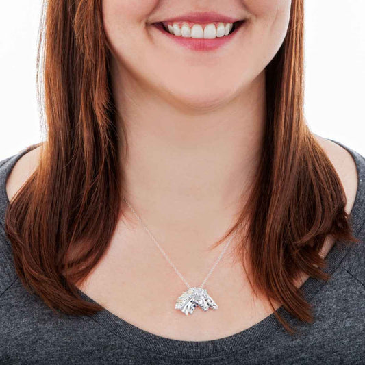 Black Hills Gold Double Horse Head Pendant in Sterling Silver front view