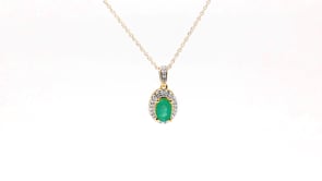 Green Oval Emerald and .08 ct. tw. Diamond Halo Pendant with Milgrain and Filigree Design in 10K Yellow Gold front view