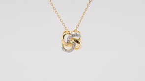 Love Knot 1/10 ct. tw. Diamond Pendant in 10K Yellow Gold front view