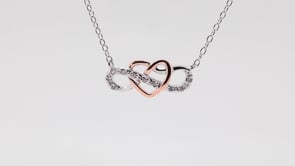 .05 ct. tw. Diamond Infinity Pendant with Rose Plated heart in Sterling Silver close-up detail