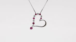 Journey Collection 1/10 ct. tw. Diamond and Ruby Heart Pendant in 10K White Gold close-up detail