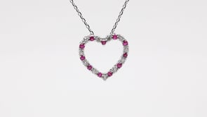 Ruby and .08 ct. tw. Diamond Heart Pendant in 10K White Gold front view