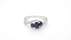 3-Stone Oval Sapphire And 1/10 ct. tw. Diamond Ring with Twist Band in Sterling Silver close-up detail