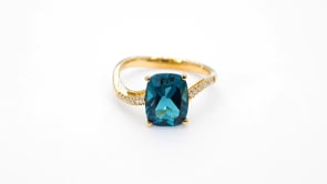 Cushion London Blue Topaz and .07 ct. tw. Diamond Ring in 10K Yellow Gold close-up detail