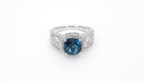 Cushion Cut London Blue Topaz Ring with White Sapphire Heart Accented Band & Halo in Sterling Silver close-up detail