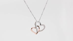 1/10 ct. tw. Diamond Heart Pendant with Rose Plated Heart Accent in Sterling Silver close-up detail