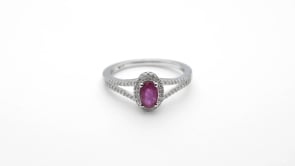 Genuine Oval Ruby Ring with 1/6 ct. tw. Diamond Halo & Split-Shank Band with Milgrain Edging in 10K White Gold side profile