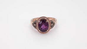 Oval Rhodolite Garnet and 1/4 ct. tw. Diamond Ring in 10K Pink Gold close-up detail