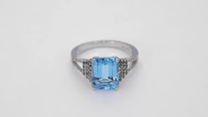 Emerald Cut Swiss Blue Topaz Ring with White Topaz Accented Band in Sterling Silver close-up detail
