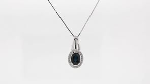 Oval Sapphire and 1/10 ct. tw. Diamond Halo Pendant in 10K White Gold front view