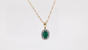 Created Oval Emerald & 1/10 ct. tw. Diamond Halo Pendant in 10K Yellow Gold front view