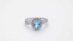 Oval Swiss Blue Topaz and Created White Sapphire Halo Ring in Sterling Silver close-up detail