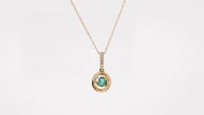 Oval Emerald and Diamond Accent Swirl Pendant in 14K Yellow Gold front view