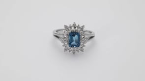 Emerald Cut London Blue Topaz & 1/5 ct. tw. Diamond Starburst Halo Ring 10K White Gold angled view