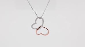 Infinite Love 1/6 ct. tw. Diamond Butterfly Pendant in Sterling Silver and 10K Pink Gold close-up detail