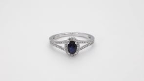 Oval Sapphire and 1/6 ct. tw. Diamond Halo Split Shank Ring in 10K White Gold close-up detail