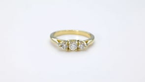 1/2 ct. tw. 3-Stone Round Brilliant Diamond Anniversary Ring in 14K Yellow Gold close-up detail
