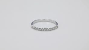 1/5 ct. tw. 13-stone prong-set anniversary band in 10K white gold close-up detail