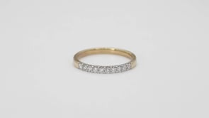 1/4 ct. tw. Classic Round Diamond Wedding Band with Prong Setting in 14K Yellow Gold close-up detail