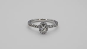 Forevermark Black Label 5/8 ct. tw Oval Diamond with Halo Engagement Ring with Round Diamond Accents in 18K close-up detail