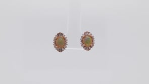 Impulse Collection Oval Opal & 1/4 ct. tw. Round & Tapered Baguette Diamond Halo Earrings in 10K Pink Gold front view