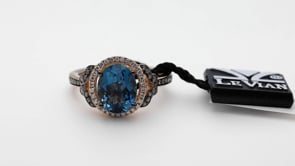 Le Vian Chocolatier Oval Deep Sea Blue Topaz & 1/4 ct. tw. Chocolate & Vanilla Diamond Halo Ring in 14K close-up detail