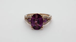 Oval Garnet & 1/5 ct. tw. Diamond Ring in 18K Pink Gold close-up detail