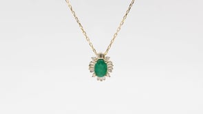 Oval Emerald & 1/6 ct. tw. Round & Baguette Diamond Starburst Halo Pendant in 10K Yellow Gold front view
