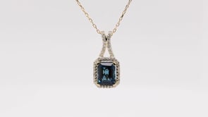 Emerald Cut London Blue Topaz & 1/4 ct. tw. Diamond Halo Pendant in 10K Yellow Gold front view