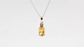 Oval Citrine & Miracle Plate Diamond Accent Pendant in 10K Yellow Gold close-up detail